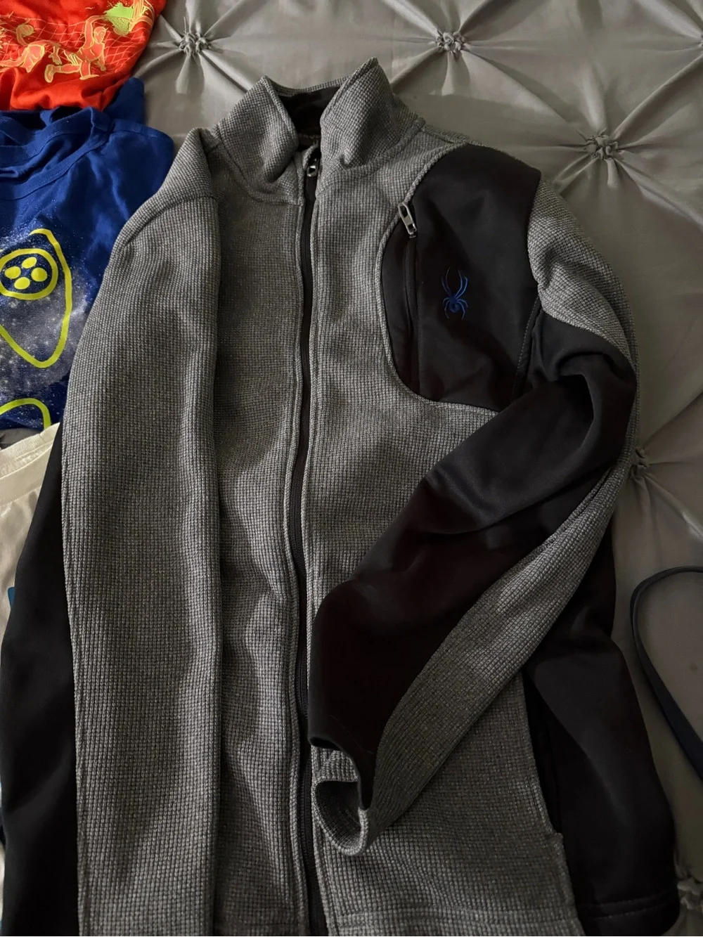 Lot of six graphic tees and one zippered Brand Spyder sweater. Size 14-16